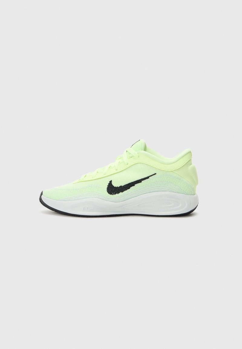 Baskets de sport vert lime avec logo Nike noir, tige en mesh, col rembourré et semelle intermédiaire blanche. Présente une semelle extérieure texturée pour une meilleure adhérence.