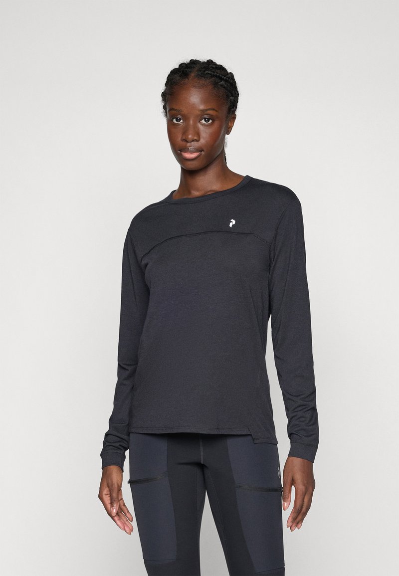 Long-sleeve shirt in dark grey with a round neckline and decorative stitching across the chest. Features a small logo on the left side.