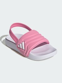 Ροζ σανδάλι με φαρδιά, υφασμάτινη λουρίδα και λευκή σόλα. Διαθέτει χαρακτηριστική τριπλή ρίγα στην πλευρά. Ομαλός, ελαφρύς σχεδιασμός.