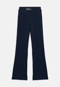 Marineblå, utsvingte bukser med elastisk midjebånd som har "TOMMY"-tekst i hvite bokstaver.