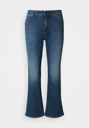 Flared denimjeans i mørkeblå med en falmet finish. Har knaplukning, fem lommer og nitte-accents ved kanten.