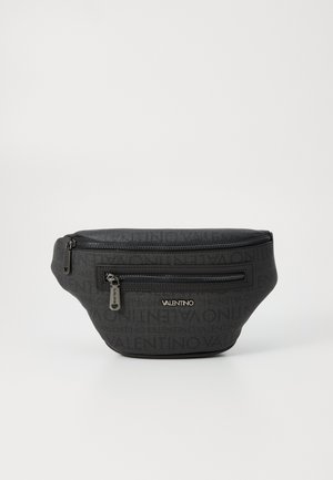 Black fanny pack made of textured fabric featuring an all-over logo pattern, a front zip pocket, and gold-tone hardware accents.