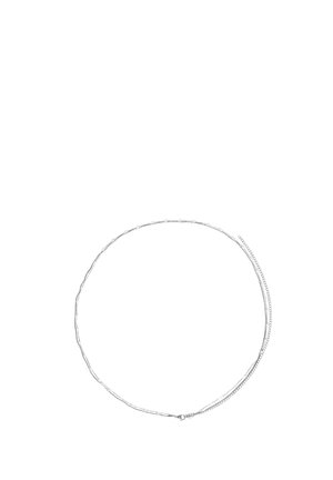 Delicate silver chain necklace with small oval links and a lobster clasp, laid flat in a circular shape on a white background.