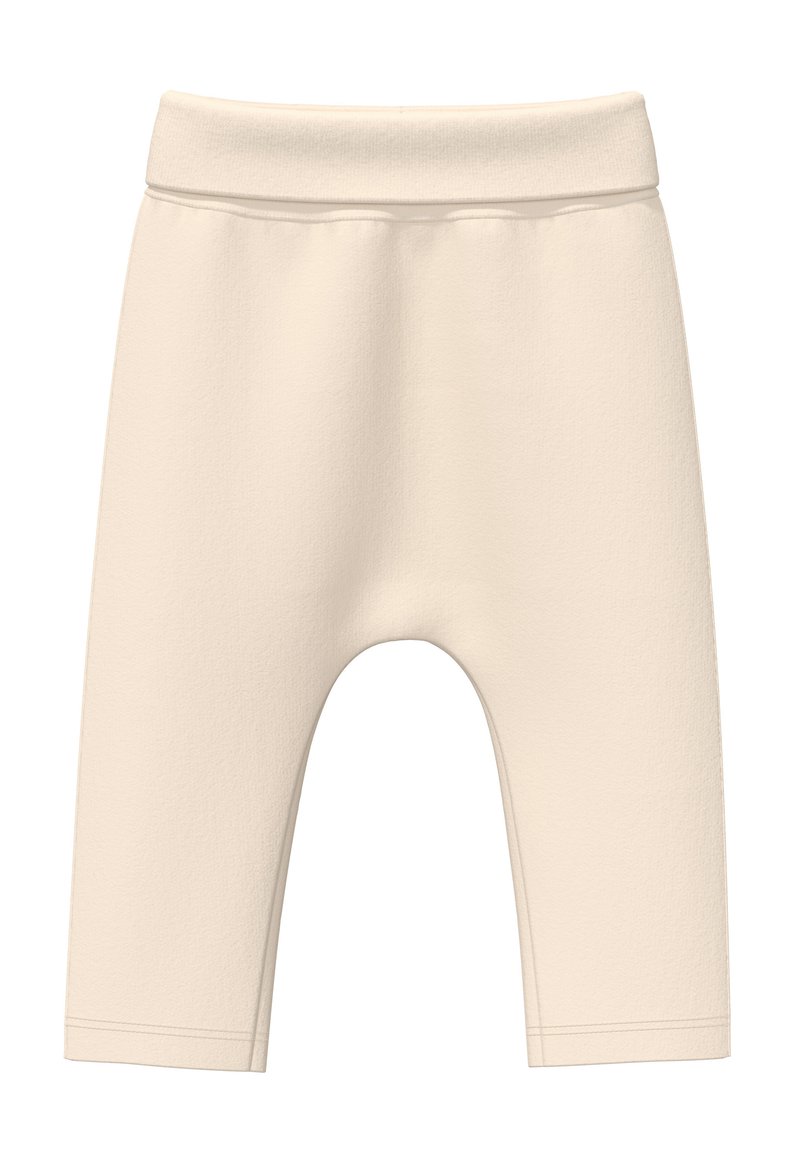 Beige Baumwollmix-Leggings mit einer weichen Textur, elastischem Bund und knielangem Schnitt. Es sind keine Muster oder zusätzlichen Beschläge vorhanden.