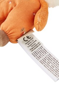 Stuffed animal hand puppet in orange fabric with mushroom patterns, soft texture, and a tag displaying safety information and care instructions.