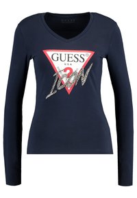 Námořnické triko s dlouhým rukávem a výstřihem do V, červený trojúhelníkový logo s nápisem "GUESS U.S.A." a "ICON" ve stříbrné výšivce. Hladký materiál.