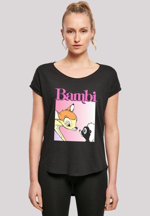 Svart T-skjorte med et Bambi-trykk i oransje og svart med rosa og hvite detaljer. Rund hals og korte ermer, avslappet passform.