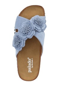 Light blue slide sandal with dual fabric flowers on the strap, soft suede-like upper, and a brown cushioned insole.