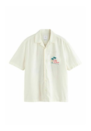 Kurzärmliges cremefarbenes Hemd mit Knöpfen und Kragen, Brustgrafik einer Palme und rotem Schriftzug „Côte d'Azur“ auf der linken Vorderseite.