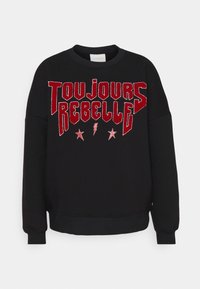 Sudadera negra con texto en terciopelo rojo "TOUJOURS REBELLE", acentuado con relámpagos y estrellas rojas. Confeccionada con una mezcla suave de algodón.