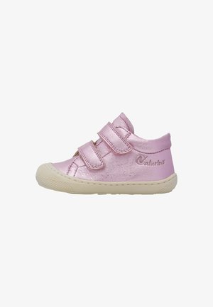 Pink metallic leather toddler shoe with double Velcro straps, rounded toe, and textured rubber sole. Features logo detail on the side.