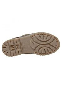 Suela de zapato de goma marrón con una superficie texturizada, que presenta un diseño de suela para mayor agarre. Logotipo de la marca visible en la zona del talón.