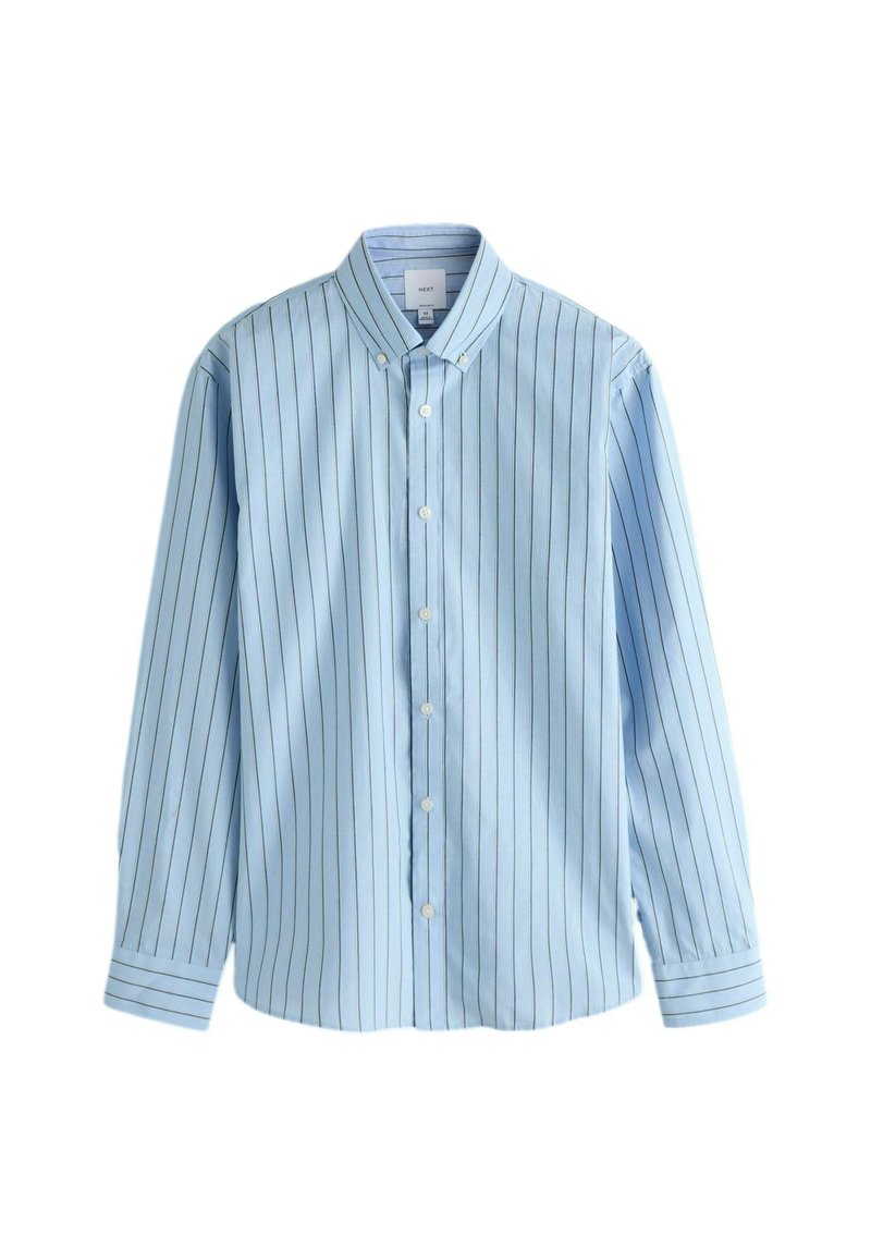 Hele sinine triiksärk vertikaalsete valgete triipudega, pikkade varrukatega ja terava kraega. Omadusena on sile kangapind ja tavapärane lõige.