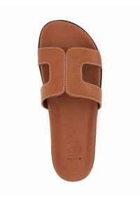 Brown leather slide sandal with two wide cut-out straps, white stitching, a smooth matte finish, and a black outsole.
