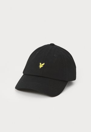 Casquette de baseball en coton noir avec une visière courbée et un logo d'aigle jaune brodé à l'avant ; six panneaux avec œillets pour la ventilation.