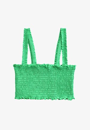 Lysegrøn smock-top med tynde, flæsekantede skulderstropper og flæsekant langs top- og bundkanter.