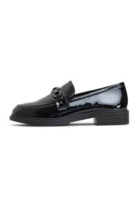 Black patent leather loafers featuring a flat heel and a decorative buckle on the vamp. Smooth texture with stitched detailing on the upper.