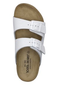 White leather slip-on sandal with two adjustable straps and metal buckles. The footbed is tan with a textured surface for grip.