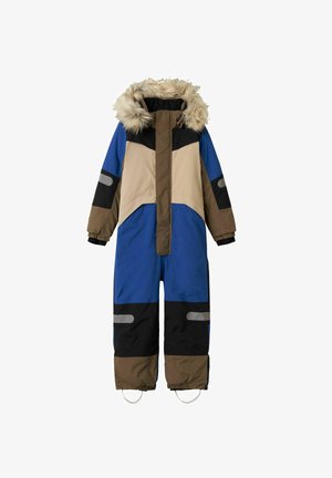 Spalvota vientisa snowsuit'as su dirbtiniu kailiu užtrauktuku, daugiausia mėlynos spalvos su smėlio ir juodais akcentais, atspindinčiomis juostelėmis ir elastingomis rankovėmis.