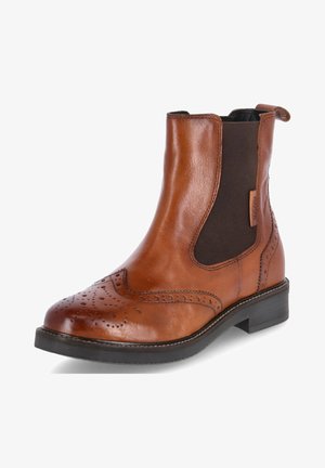 Bottine Chelsea en cuir marron avec détails brogués, empiècements élastiques sur les côtés et petit talon noir. Texture lisse et design classique.