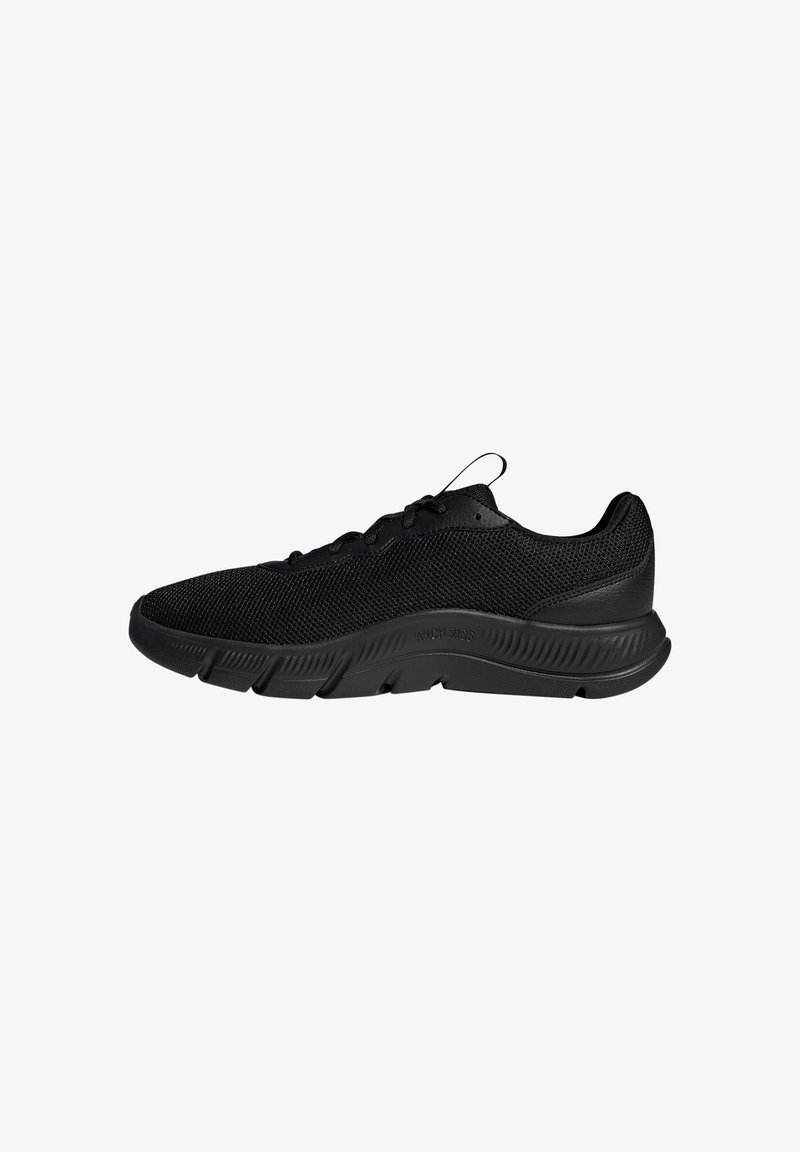 Black low-top athletic shoe with mesh upper, lace closure, textured sole, and pull tab on tongue against white background.