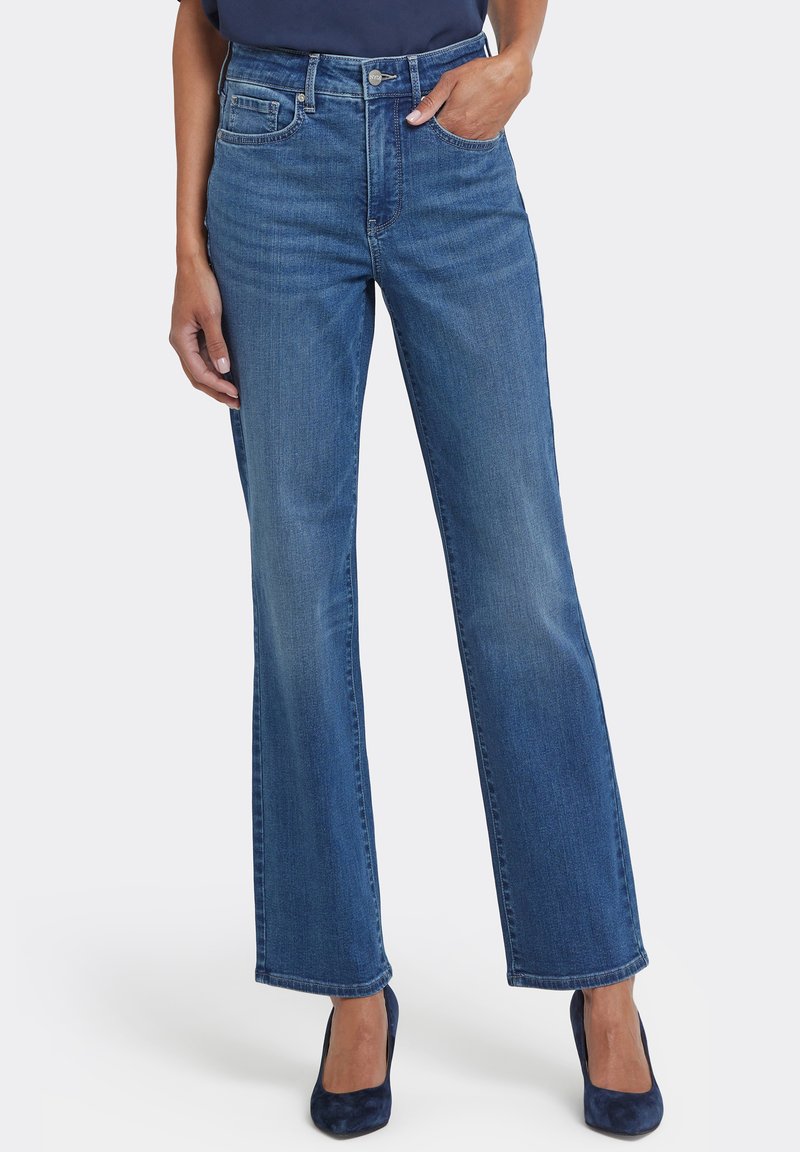 Blå denimflare-jeans med hög midja, med fem fickor, knappstängning och subtil blekning på låren.