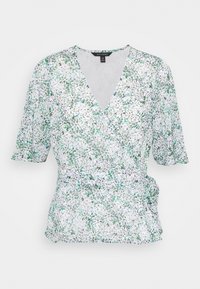 Blusa a fiori bianca con dettagli verde. Presenta maniche corte a sbuffo, una profonda scollatura a V e un dettaglio arricciato sul lato. Tessuto leggero.