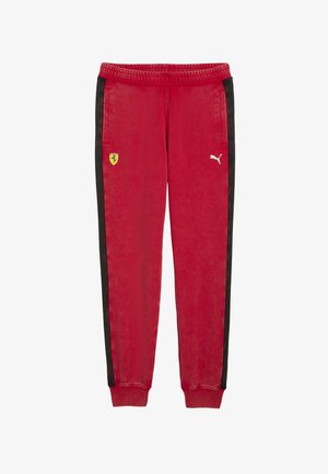 Red sweatpants with black side stripes. Features pockets, elastic waistband, and logo accents: Ferrari emblem and Puma logo in white.