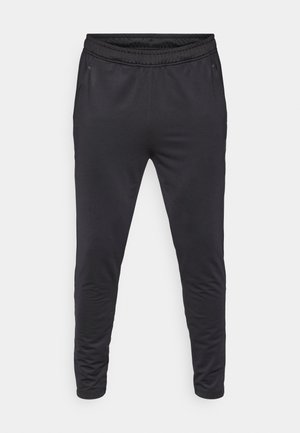 Schwarze sportliche Jogginghosen mit elastischem Bund, schmal zulaufenden Beinen und Seitentaschen. Hergestellt aus einem glatten, leichten Material.