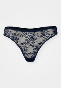 String en dentelle marine avec des motifs floraux, des panneaux en mesh et une taille lisse pour un port confortable.
