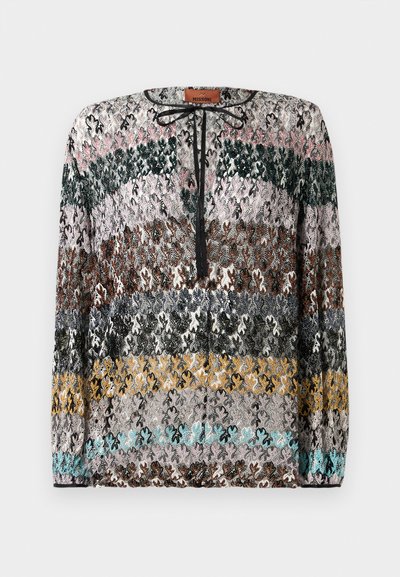 Long-sleeve sweater with horizontal zigzag stripes in black, pink, green, brown, gray, yellow, and turquoise, featuring a black tie neckline.