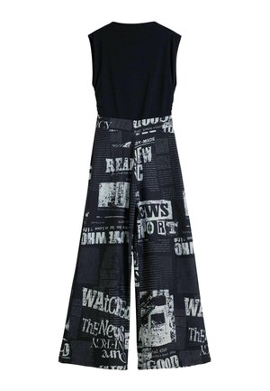 Black sleeveless jumpsuit with a solid top and wide-leg printed trousers featuring a newspaper text pattern in white and grey.