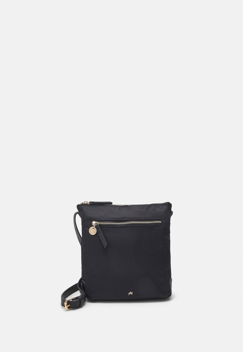 Black crossbody bag with a front zipper pocket and gold accents, featuring a detachable strap. Plain background highlights the product.