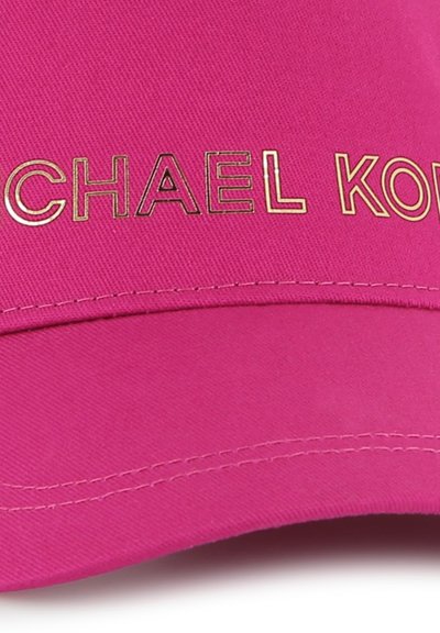 Pink baseball cap featuring a curved brim, smooth texture, and gold printed text "MICHAEL KORS" on the front.