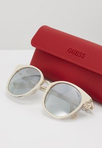 Guess Óculos de sol - beige