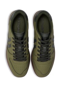 Green sneaker with leather and textile upper, round toe, grey accents, lace-up design, padded collar, and rubber sole.