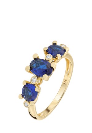 Gold ring with three oval blue gemstones and four small round white diamonds set along the band, stamped with 925 for silver.