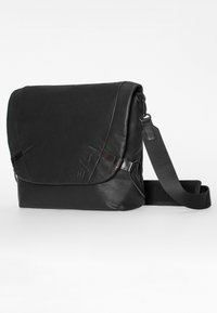 Black leather messenger bag with flap closure, adjustable black fabric shoulder strap, and subtle embossed branding on front flap.
