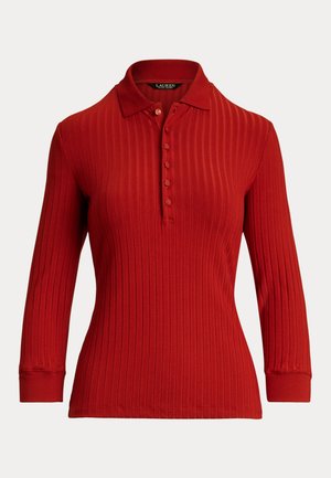 Red ribbed long-sleeve polo shirt with a collar and button placket. Features a fitted silhouette and textured fabric.