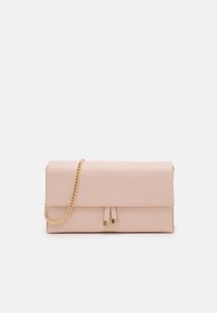 Rectangular pale pink clutch bag with gold chain strap and two tassels with gold tips on front flap, set against white background.