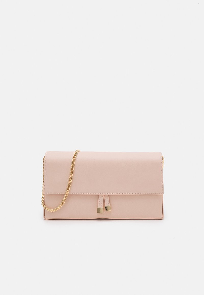 Rectangular pale pink clutch bag with gold chain strap and two tassels with gold tips on front flap, set against white background.