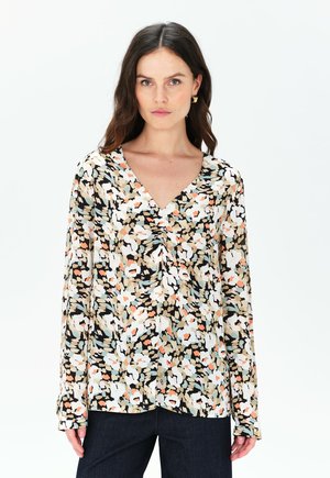 Blusa a fantasia floreale con scollatura a V, maniche lunghe, nei colori nero, bianco, beige e tonalità pastello. Tessuto leggero con una consistenza morbida.
