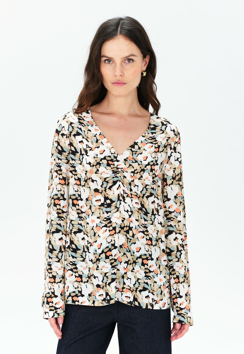 Blusa a fantasia floreale con scollatura a V, maniche lunghe, nei colori nero, bianco, beige e tonalità pastello. Tessuto leggero con una consistenza morbida.