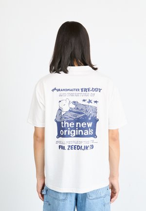 White t-shirt featuring a blue graphic design on the back with text and illustrations. Short sleeves, relaxed fit.