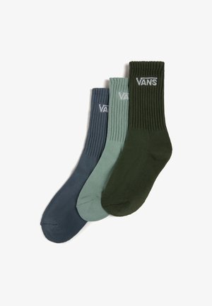 Tři páry žebrovaných ponožek v tmavě modré, světle zelené a tmavě zelené barvě, z nichž každé má na manžetě bílé logo "VANS".