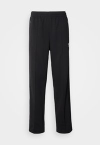 Svarta träningsbyxor av lätt material med elastisk midja, sidofickor och rak benen-design med sidodetaljer.