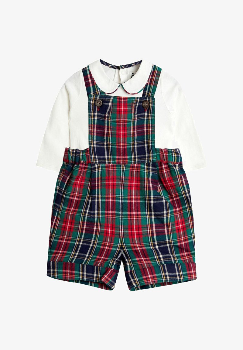 Balta ilgomis rankovėmis marškiniai su Peter Pan tipo apykakle, derinami su raudonais, žaliais ir tamsiai mėlynais languotais šortais, su mygtukais ant krūtinės.