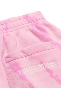 Roze tie-dye joggingsbroeken met een elastische tailleband, voorzien van een achterzak en 'TOMORROWLAND' geborduurd in het wit. Zacht katoen materiaal.