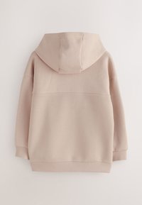 Šviesiai rožinis džemperis su gobtuvu, apatinė dalis su tekstūruota, ribinėmis detalėmis, minkšta medžiaga ir laisvo kirpimo. Turi paprastą, šiuolaikišką dizainą.