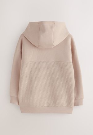 Hele roosa kapuutsiga dressipluus, mille alumine osa on soonikkoeline, pehme kangas ja mugav lõige. Omaduseks on lihtne, kaasaegne disain.